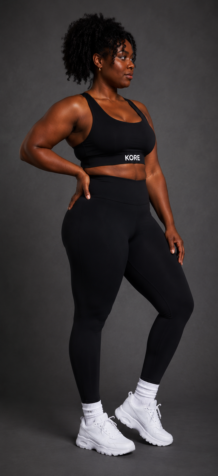 KORE Sculpt Leggings — side profile showing second-skin compression, hidden side pocket, and KORE underband logo