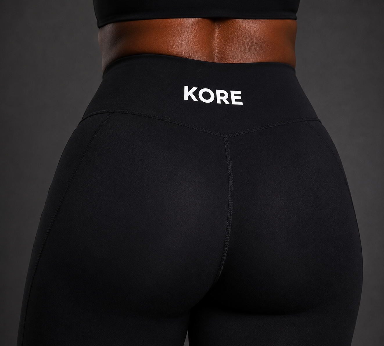 KORE Sculpt Leggings — close-up of back waistband with sharp KORE logo, glute seam, and premium fabric texture
