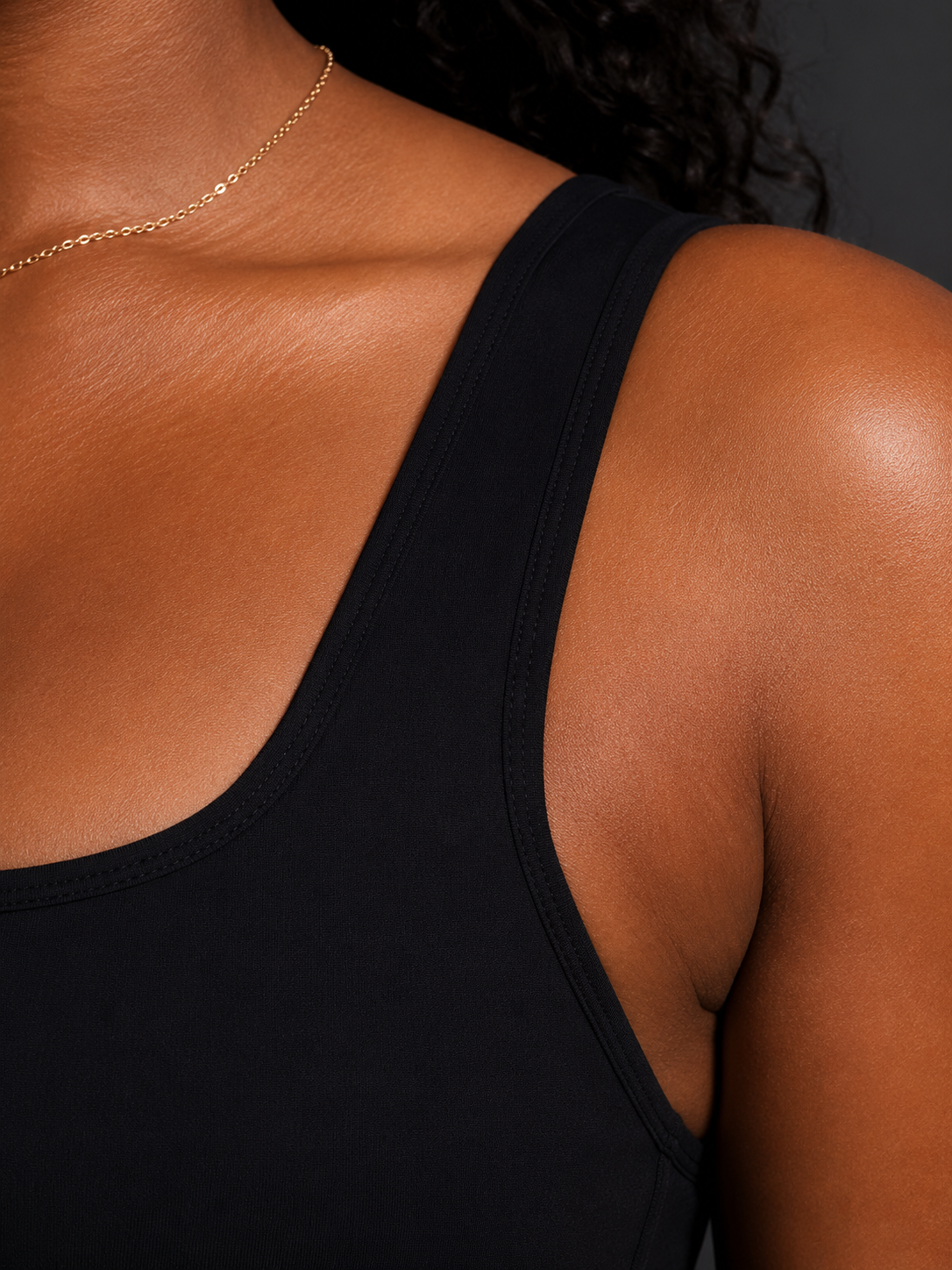 KORE Sculpt Bra — close-up of the shoulder strap, neckline, and stitching detail